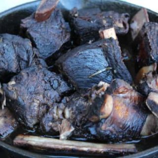 wine braised short ribs in a pan