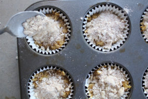 sprinkle streusel topping over banana muffins