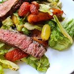 grilled steak with salad and roasted bell pepper