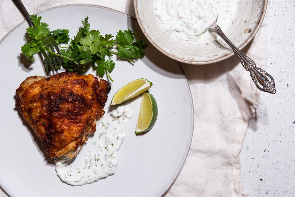 chicken thigh with yogurt sauce and cilantro