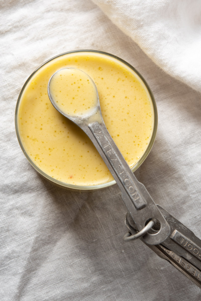 yellow lemon garlic sauce with measuring spoons