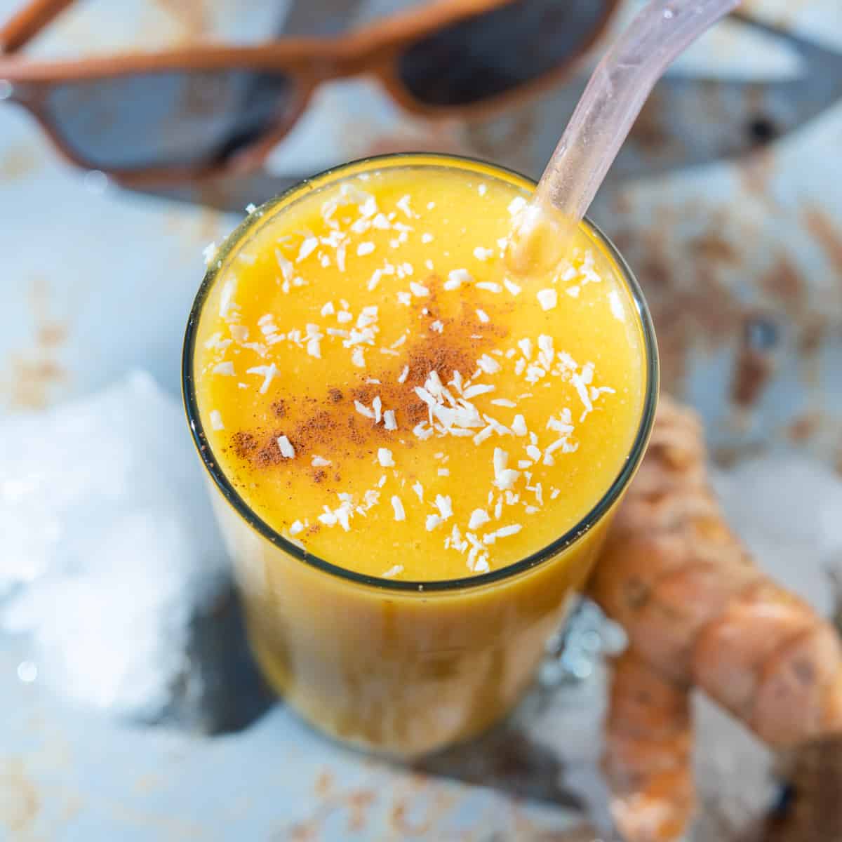 https://thefrayedapron.com/wp-content/uploads/2020/11/tropical-mango-pineapple-smoothie-with-turmeric-and-coconut.jpg