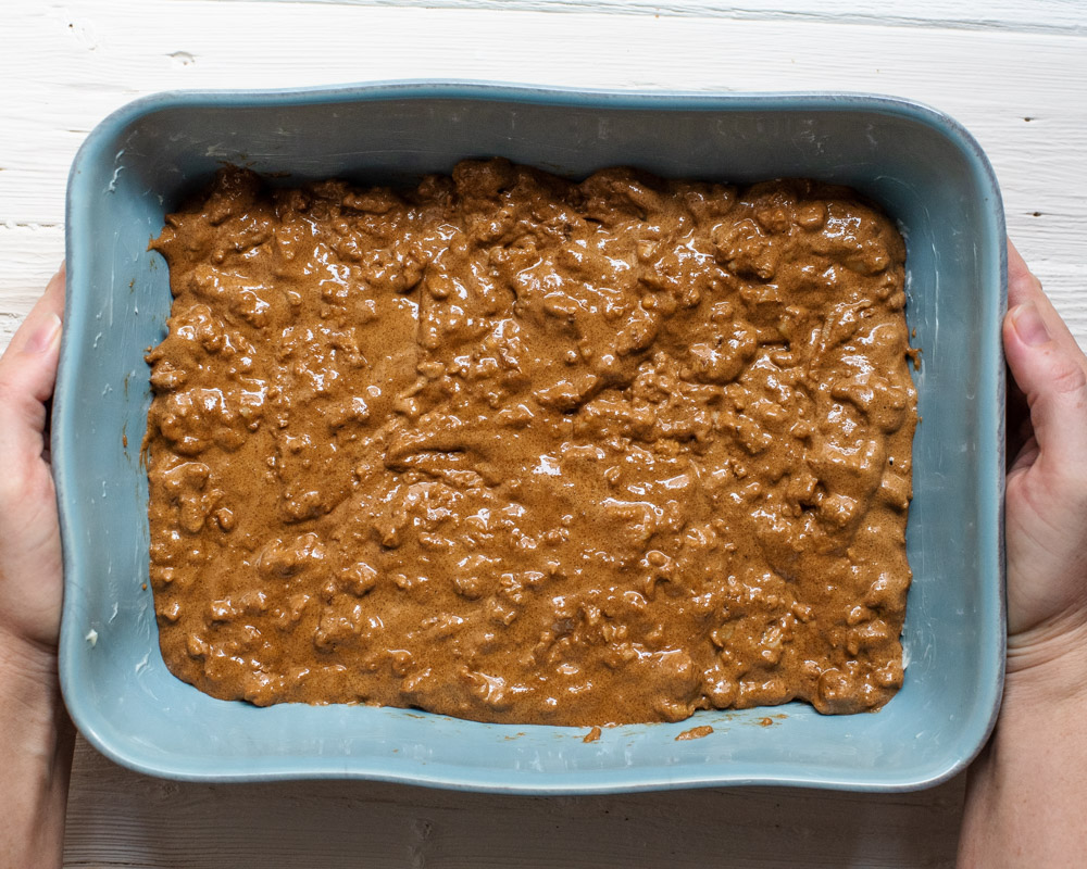 walnut brown sugar batter spread in a greased baking dish