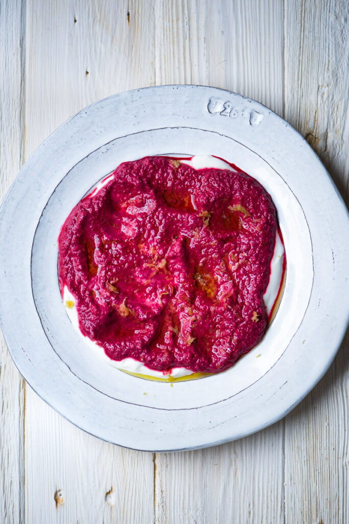 raw beet puree over plain yogurt with lemon zest and extra virgin olive oil