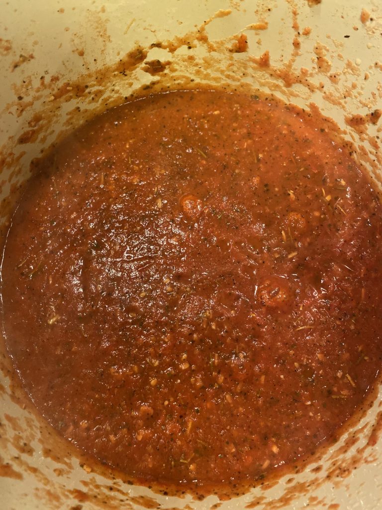 homemade Roma tomato sauce in Dutch oven blended until smooth