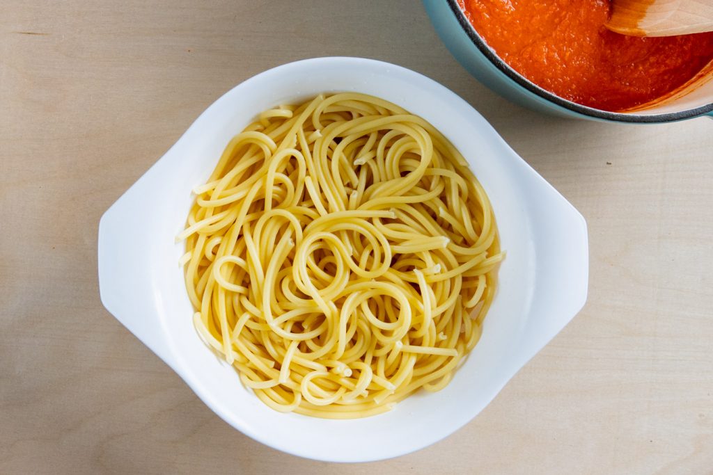 Bucatini noodles strained in collander