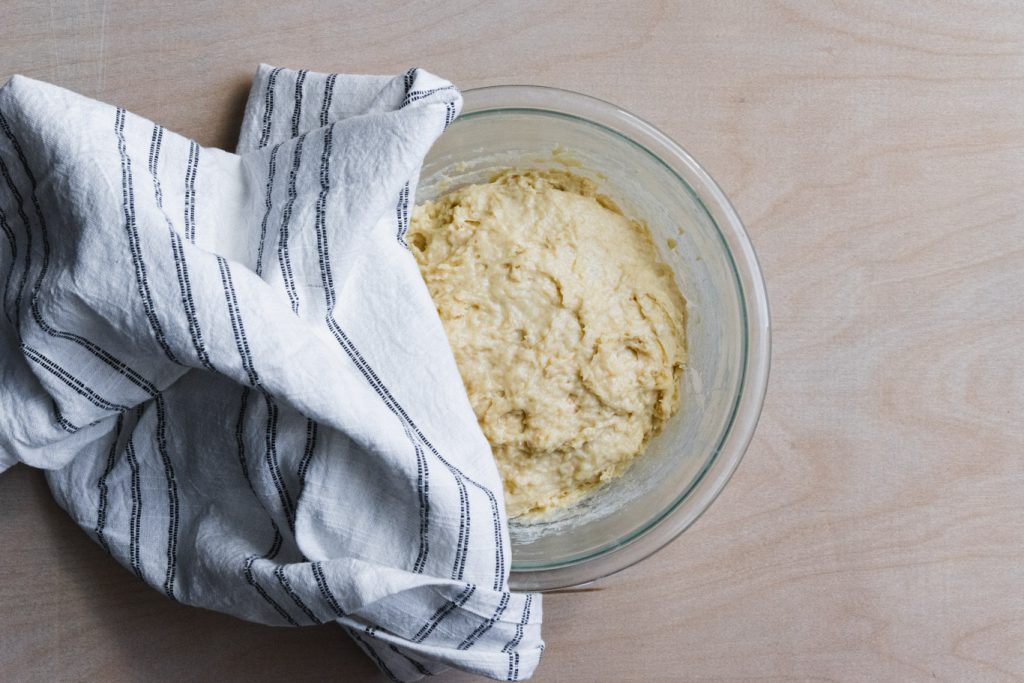 donut dough mixture covered in bowl