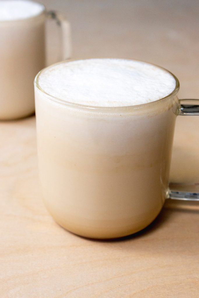 Earl Grey tea with foamed milk in a mug