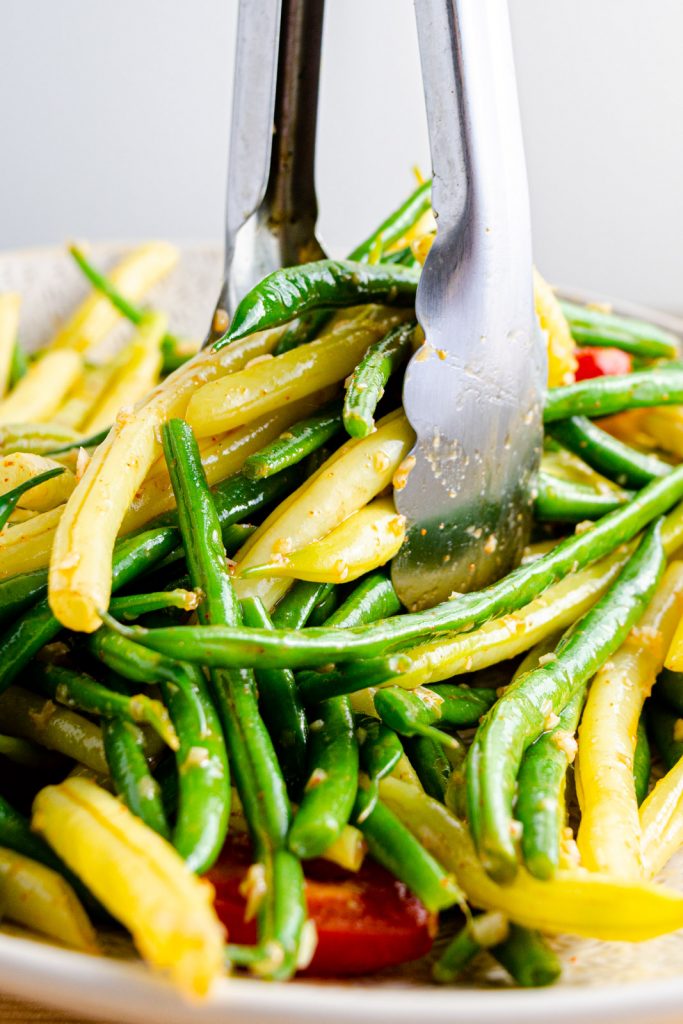 serving garlic vinaigrette tossed with green beans