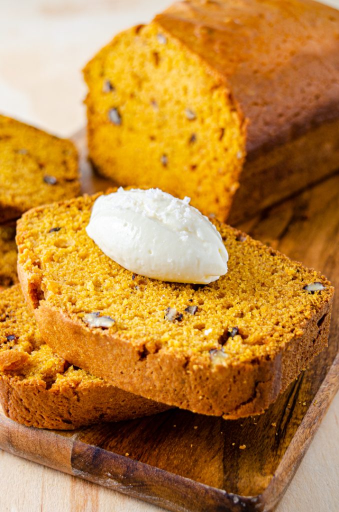 sliced pumpkin bread with mascarpone on top