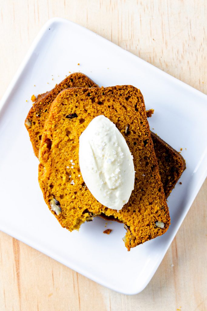 mascarpone quenelle on top of sliced pumpkin bread