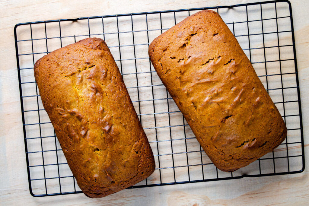 baked pumpkin loaves on cooling rack