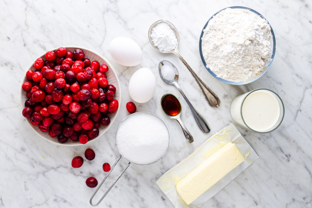 fresh cranberries, eggs, sugar, flour, milk, butter, vanilla, baking powder, and salt