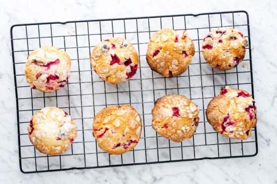 fresh cranberry muffins on cooling rack
