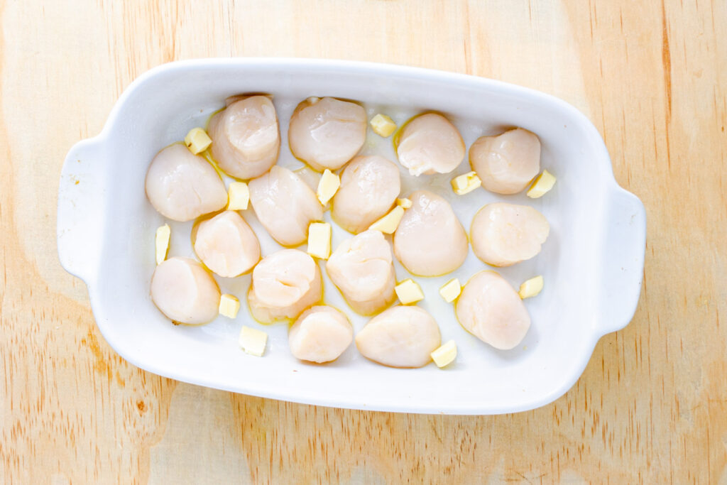 sea scallops with butter in baking dish