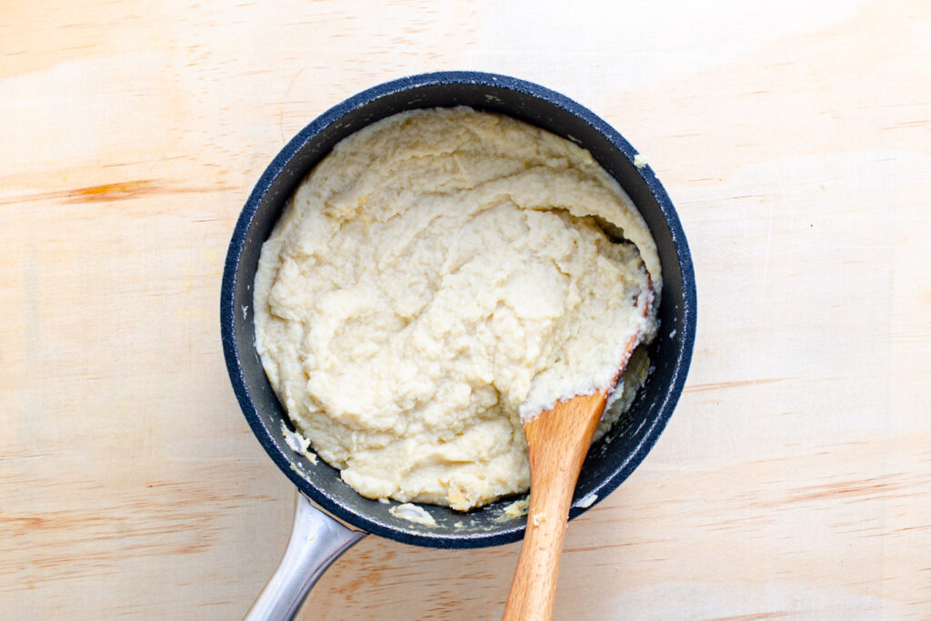 cauliflower puree in pot with cream cheese and butter