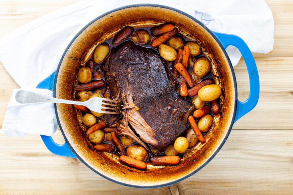 fork tender London broil cooked in a Dutch oven