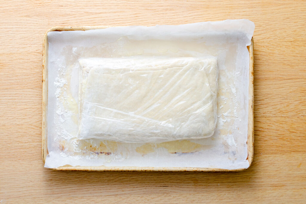 Danish pastry dough wrapped in plastic wrap