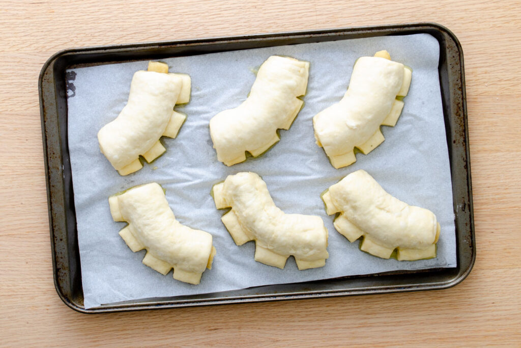 bear claw shaped pastries on a tray