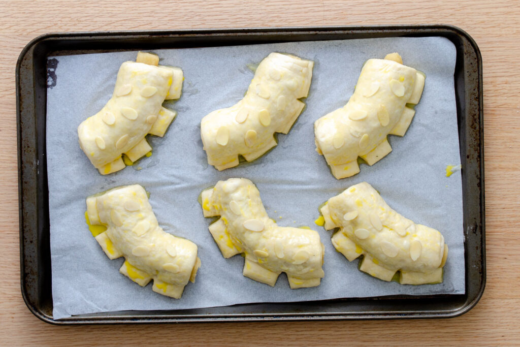 bear claw shaped pastries on baking tray