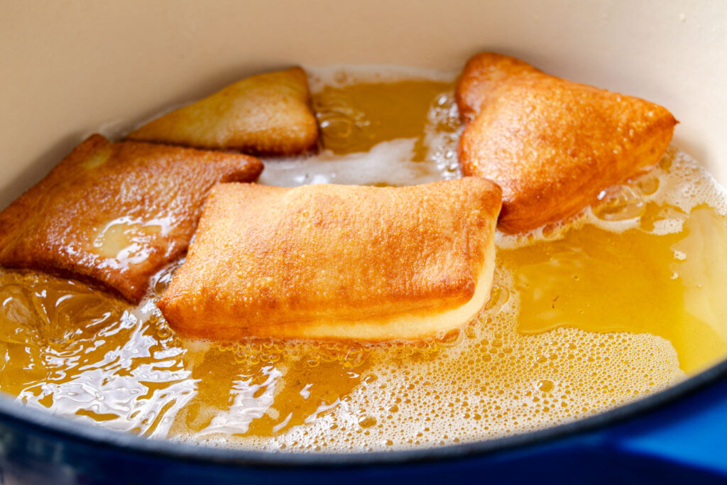 beignets frying in oil