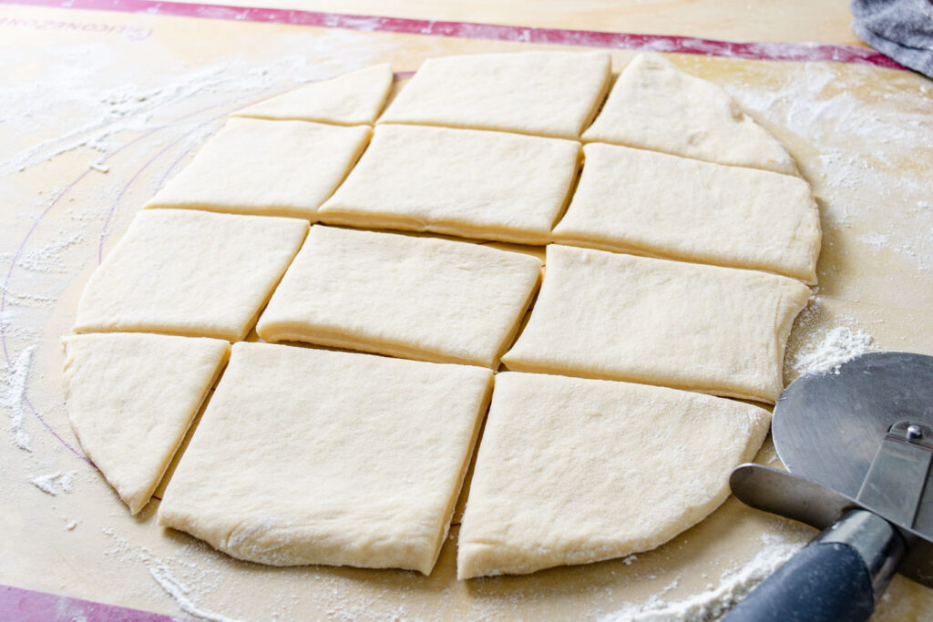 smooth beignet dough cut into squares