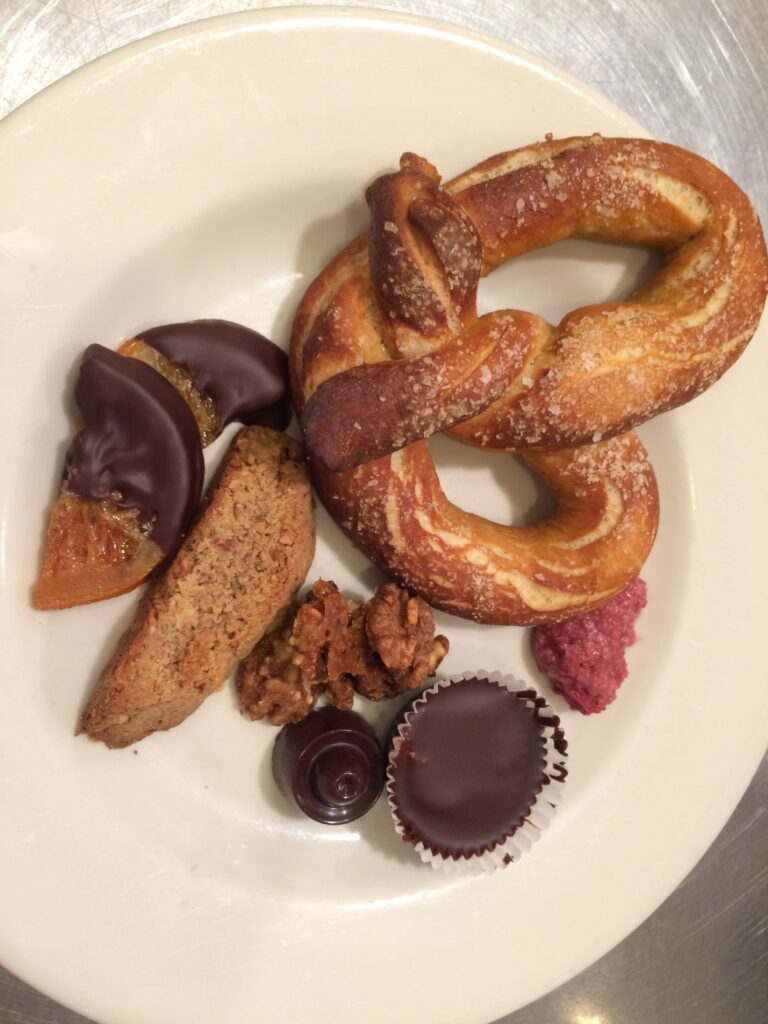 candied orange slices dipped in chocolate plated with homemade snacks