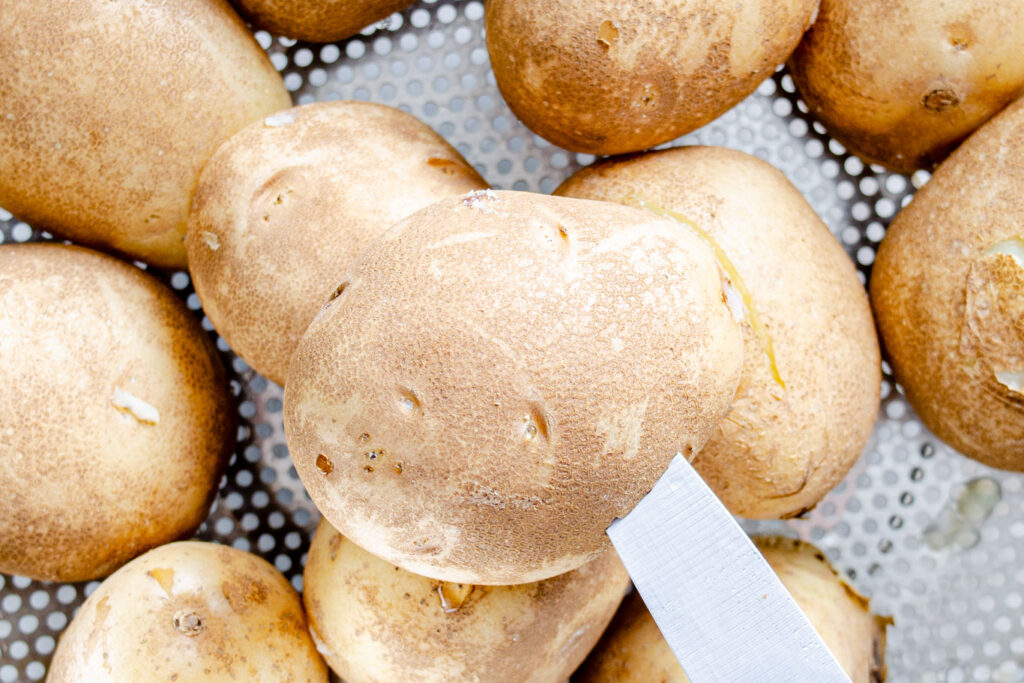 boiled potatoes in collander