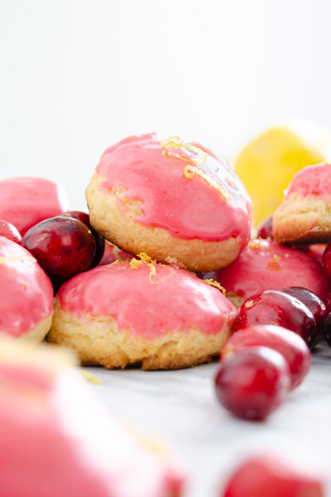 lemon zest over cranberry lemon glazed lemon sugar cookie
