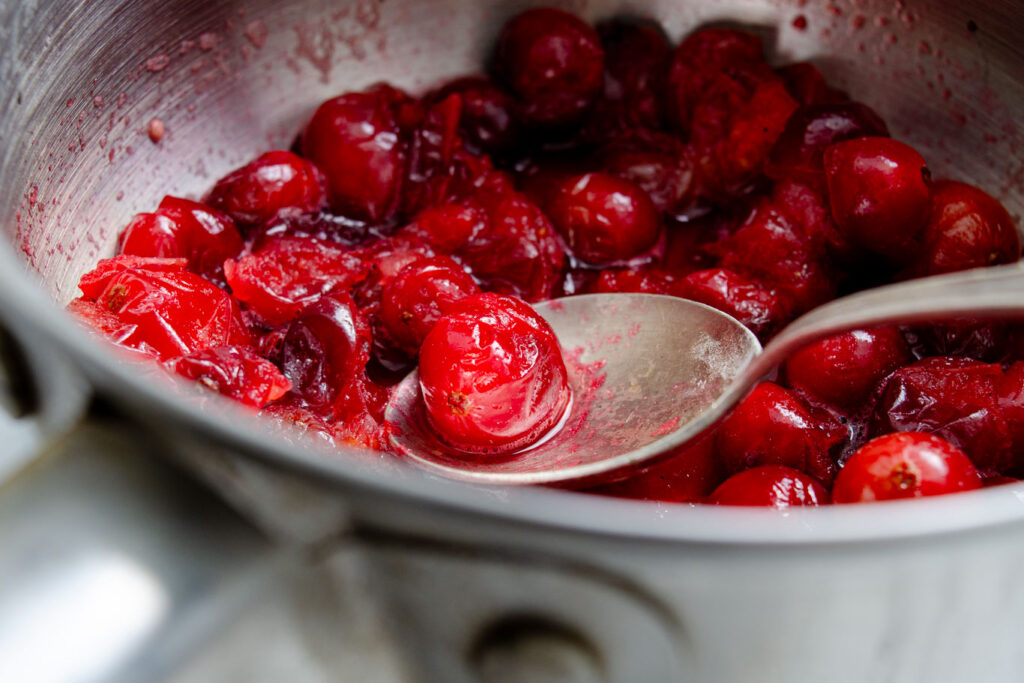fresh cranberries simmered until soft in pot