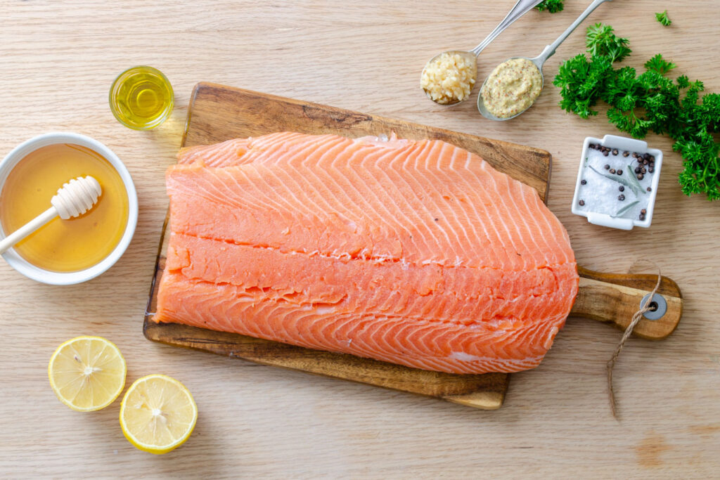 honey, olive oil, garlic, dijon mustard, salt, pepper, salmon fillet, lemon