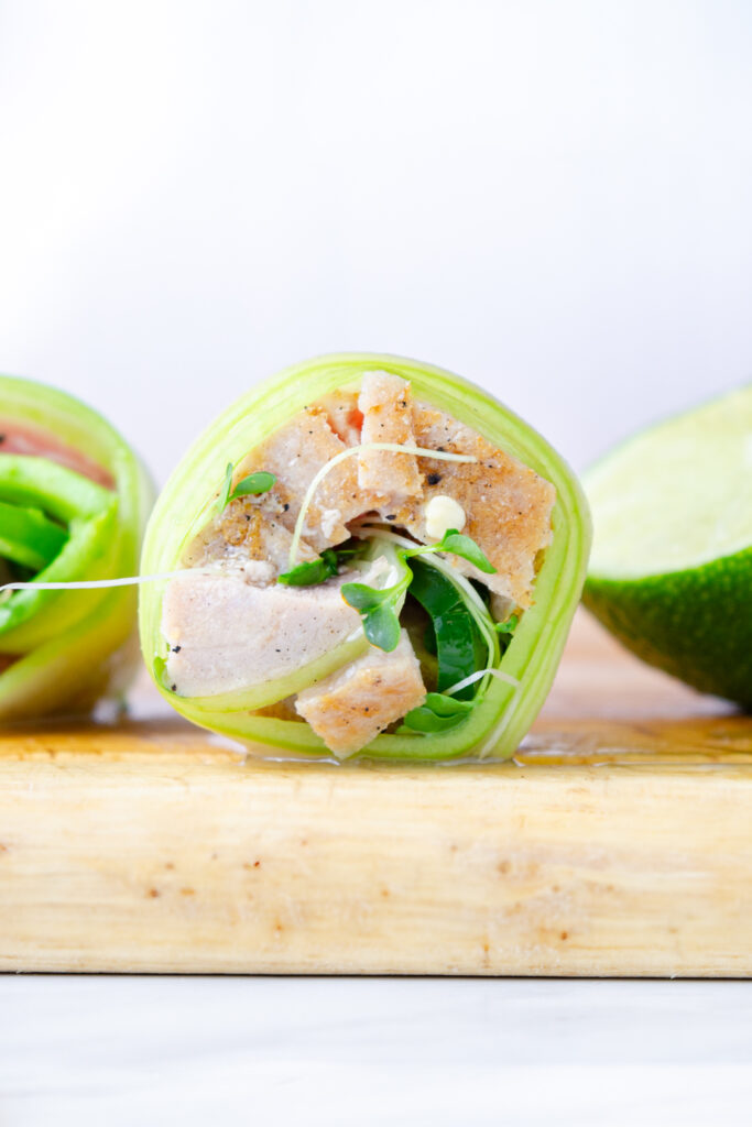 cucumber rolled around seared tuna with jalapeno, avocado, and microgreens