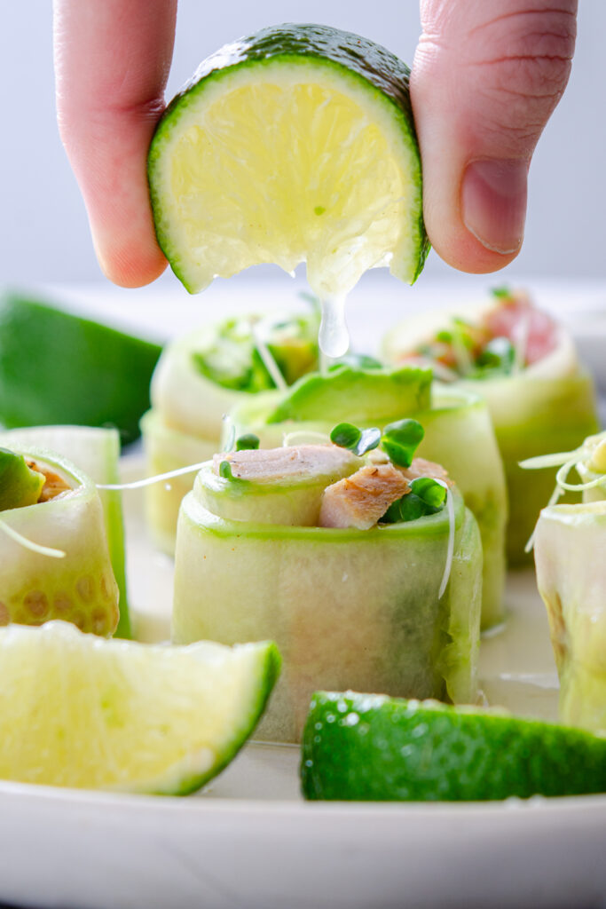 lime juice squeezed over rolled cucumber tuna wrap