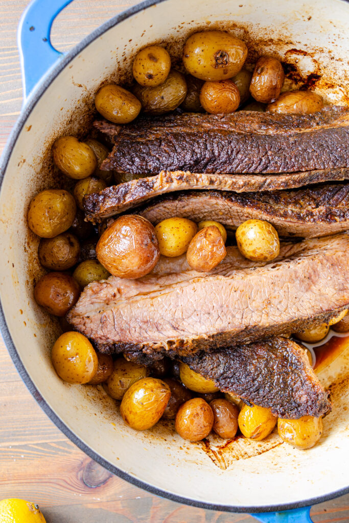 brisket cooked in Dutch oven with potatoes