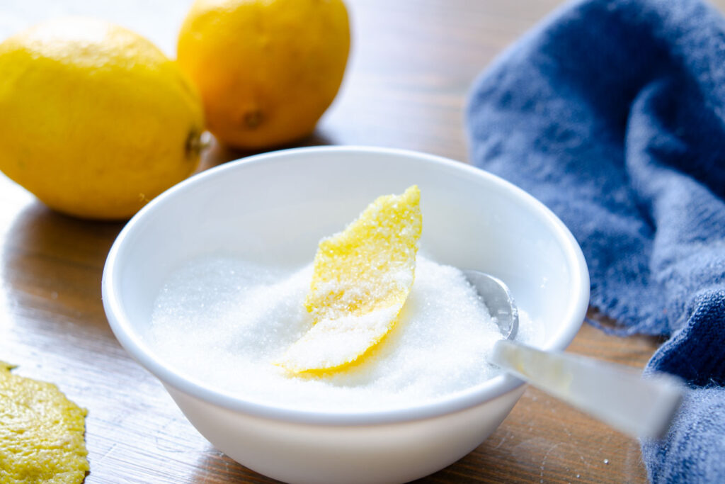 lemon zest in bowl with sugar
