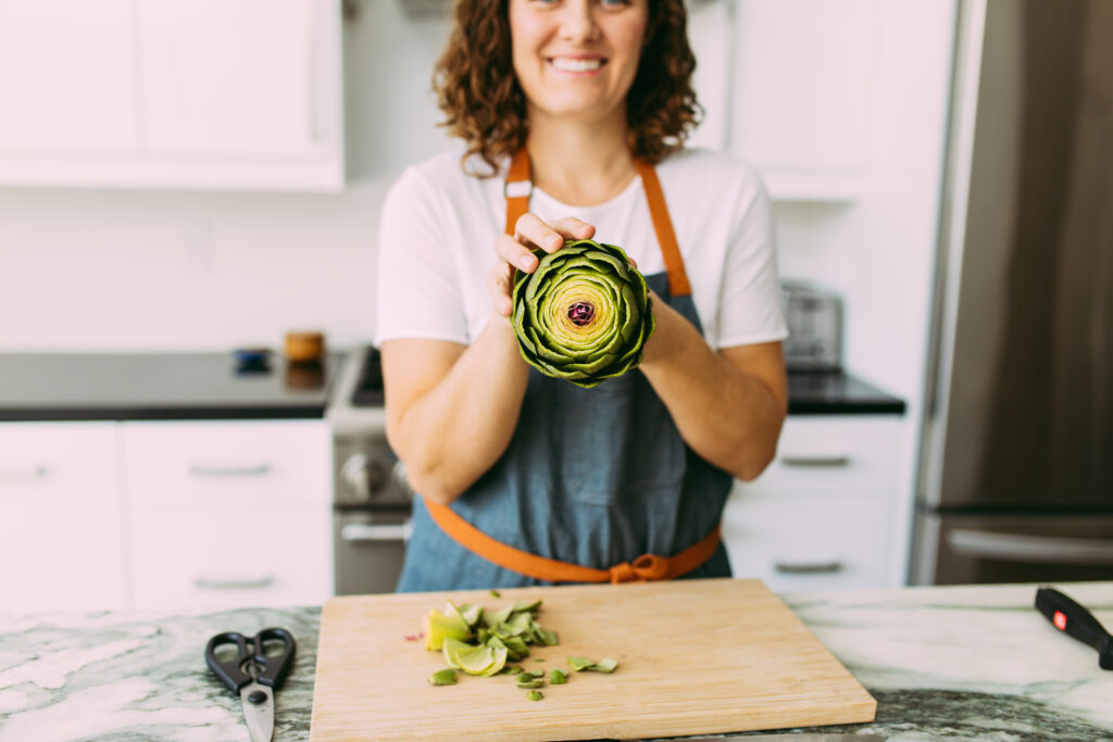 chef Sara Furcini holding artichoke 