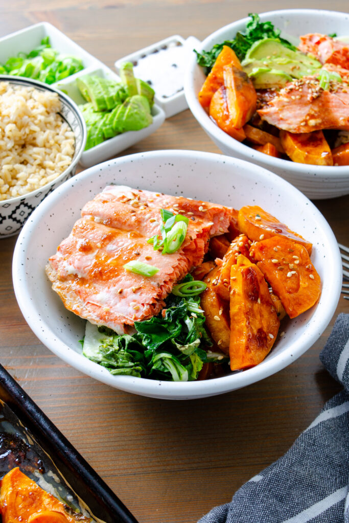 baked salmon with sesame glazed sweet potatoes and bok choy in a bowl