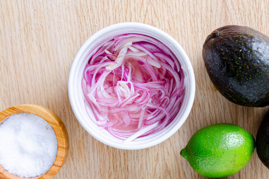 red onion thinly sliced quick pickling in lime juice with salt