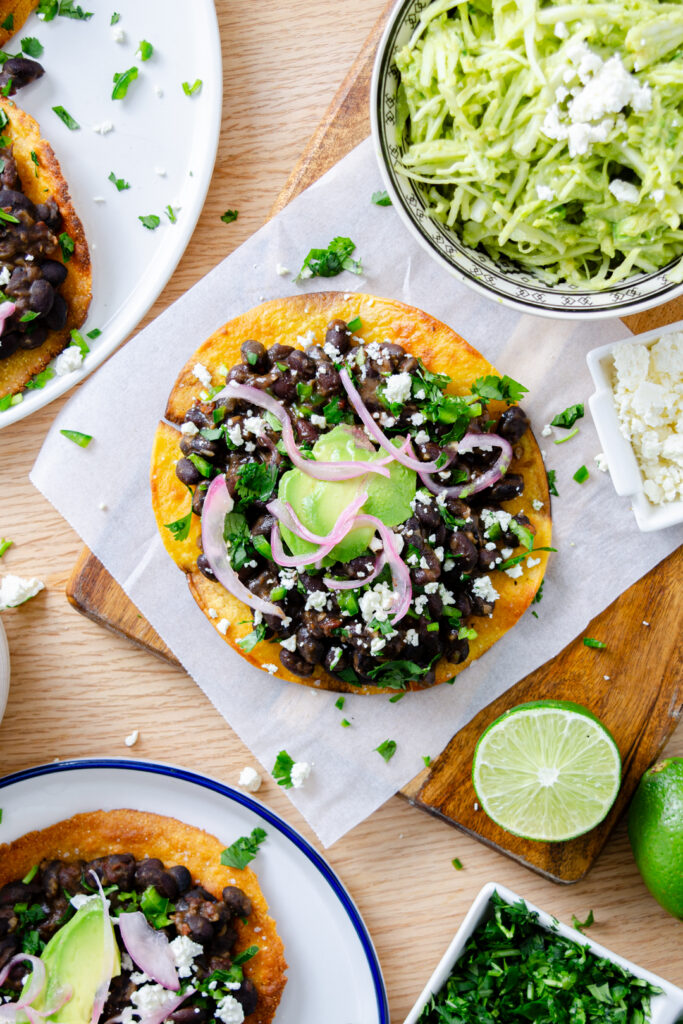 black bean tostada with pickled red onion