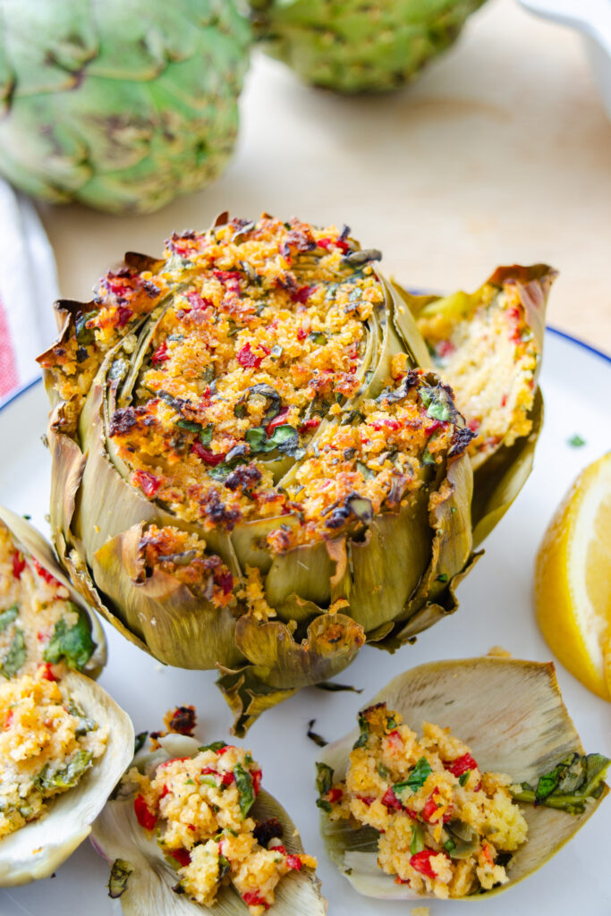 whole roasted stuffed artichoke made with vegan breadcrumb filling